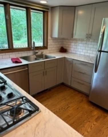 1125 Morningside Drive Elgin, IL 60123 - Photo 5 of 42 a kitchen with a sink stove and cabinets