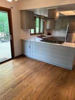 1125 Morningside Drive Elgin, IL 60123 - Photo 6 of 42 a kitchen with a stove and a window
