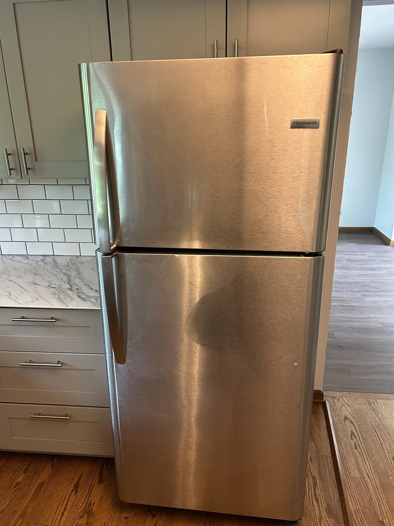 1125 Morningside Drive Elgin, IL 60123 - Photo 8 of 42 a close view of a refrigerator in kitchen
