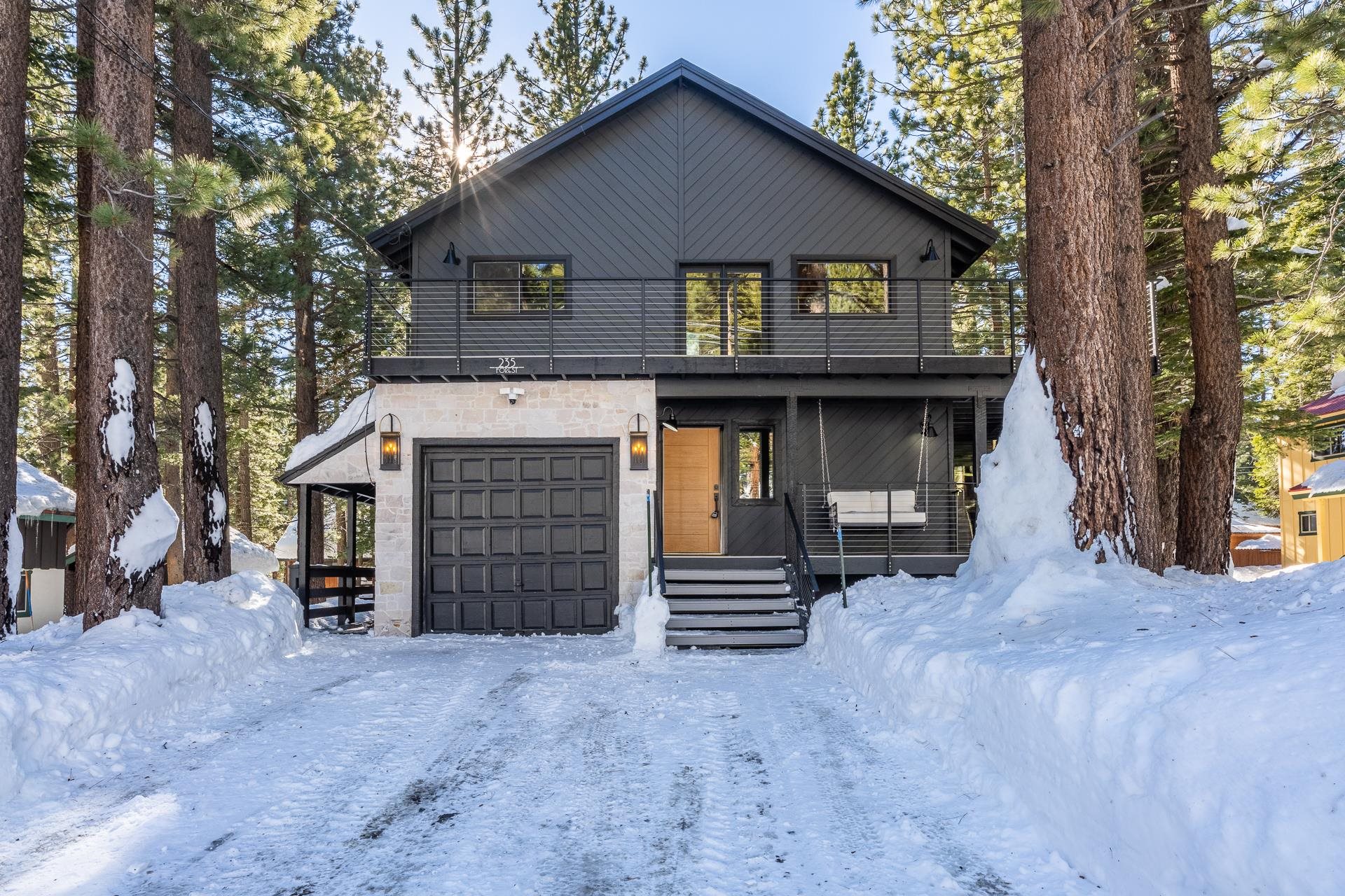 Modern home featuring an attached garage and a balcony