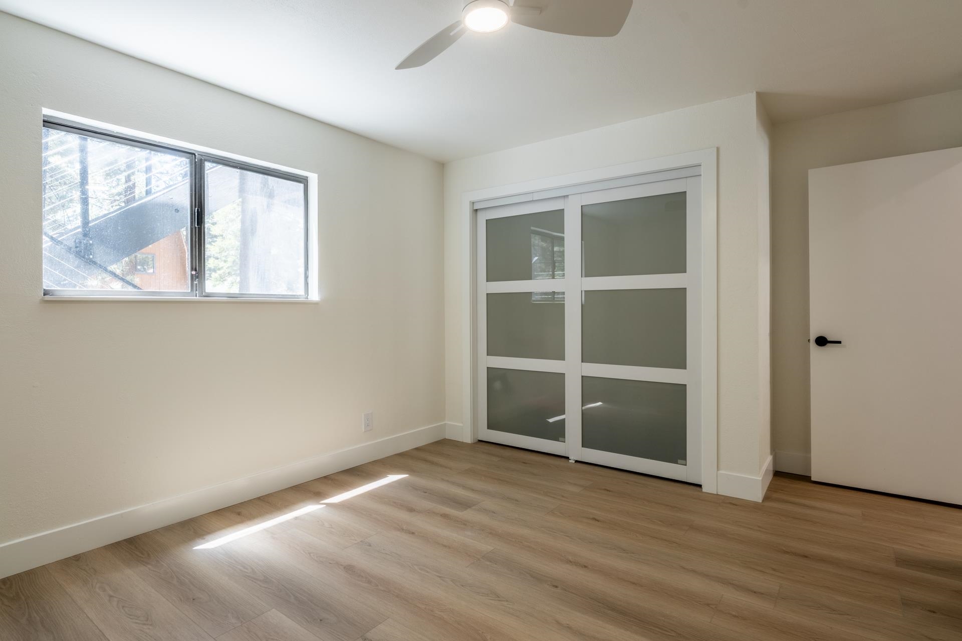 235 Forest Trail Mammoth Lakes, CA 93546 - Photo 22 of 35 Unfurnished bedroom featuring light wood-style flooring and a ceiling fan