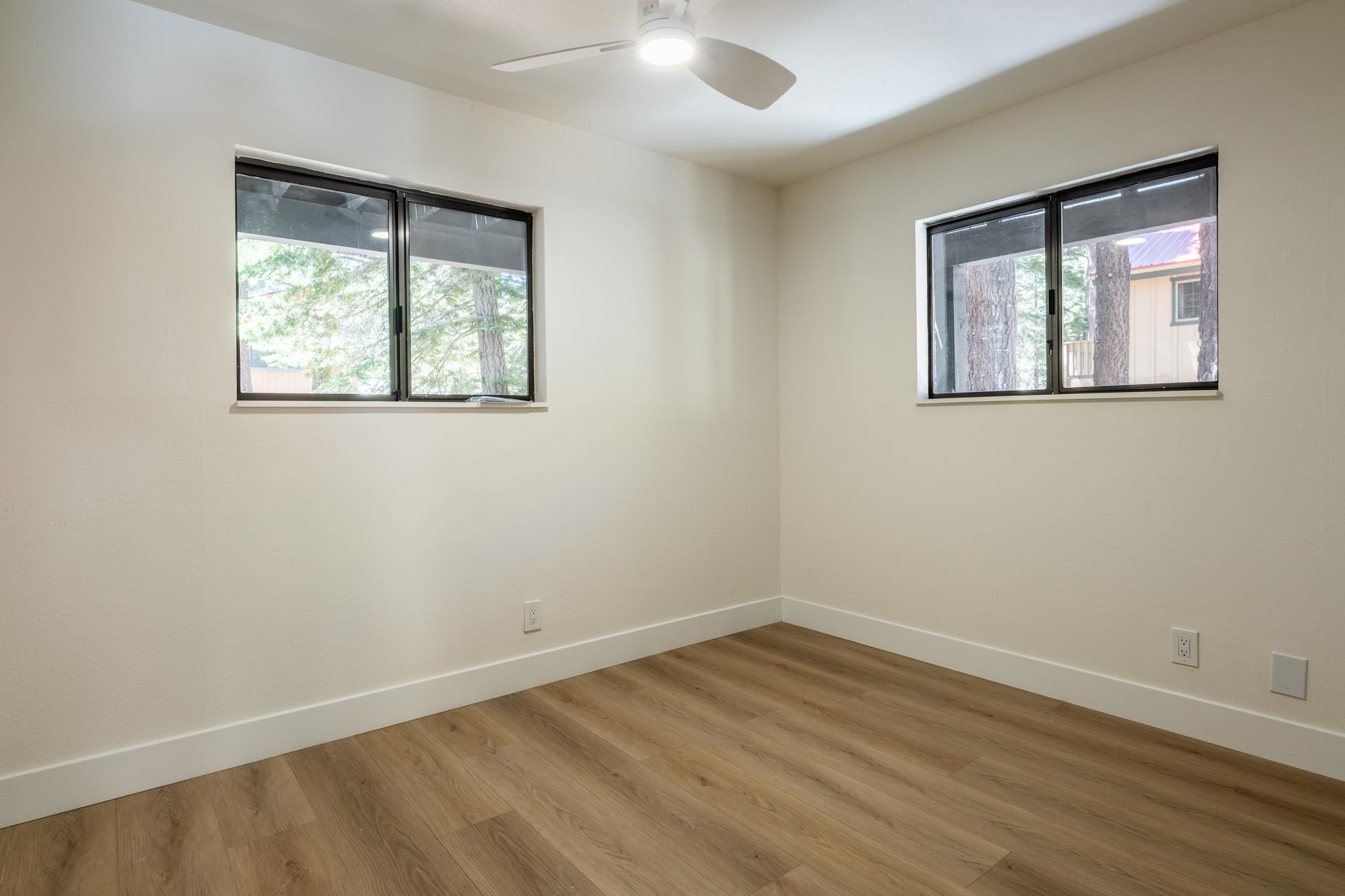 235 Forest Trail Mammoth Lakes, CA 93546 - Photo 25 of 35 Unfurnished room featuring wood finished floors and ceiling fan