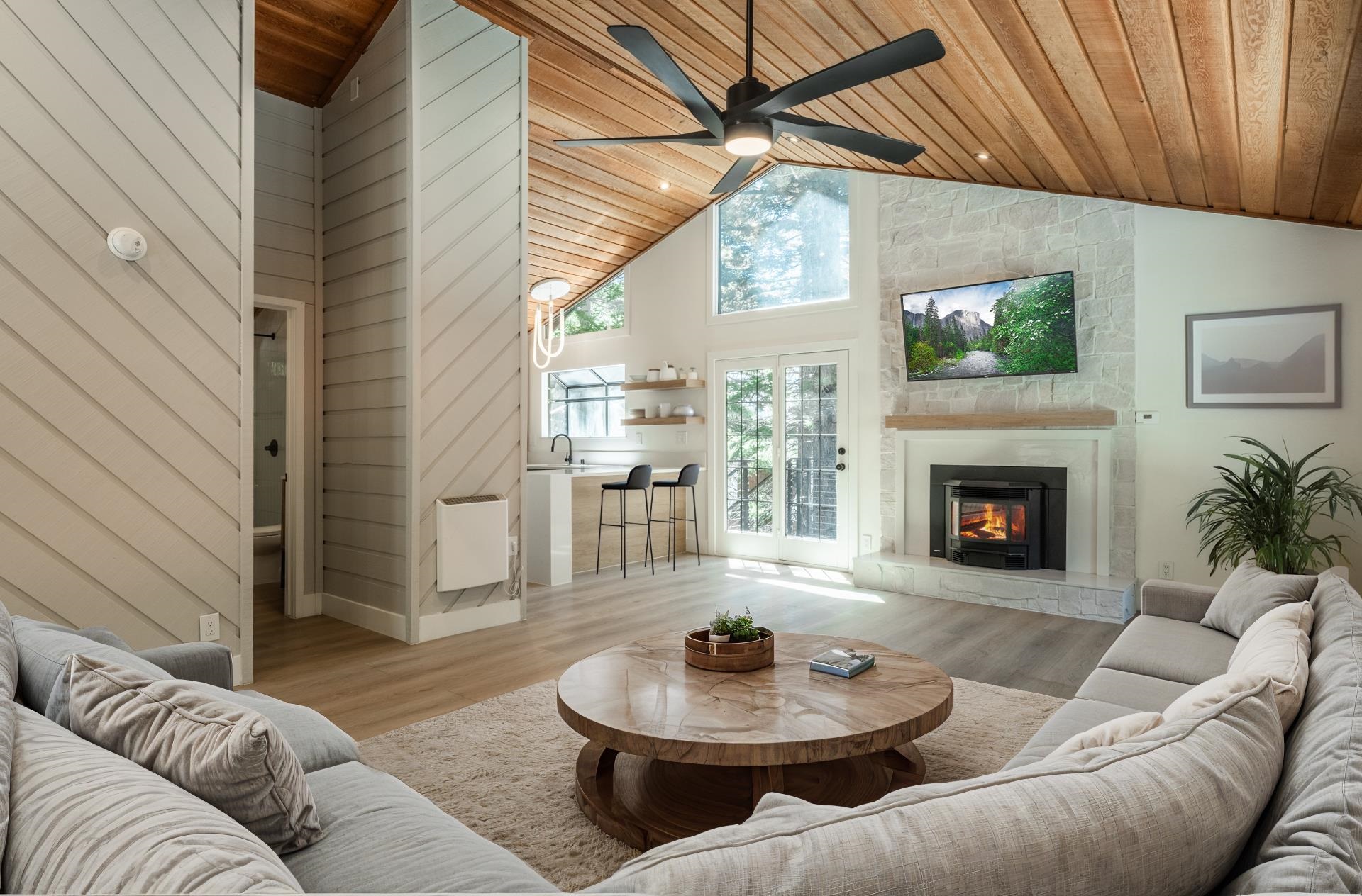 235 Forest Trail Mammoth Lakes, CA 93546 - Photo 8 of 35 Living area with high vaulted ceiling, light wood finished floors, wooden ceiling. Virtually staged