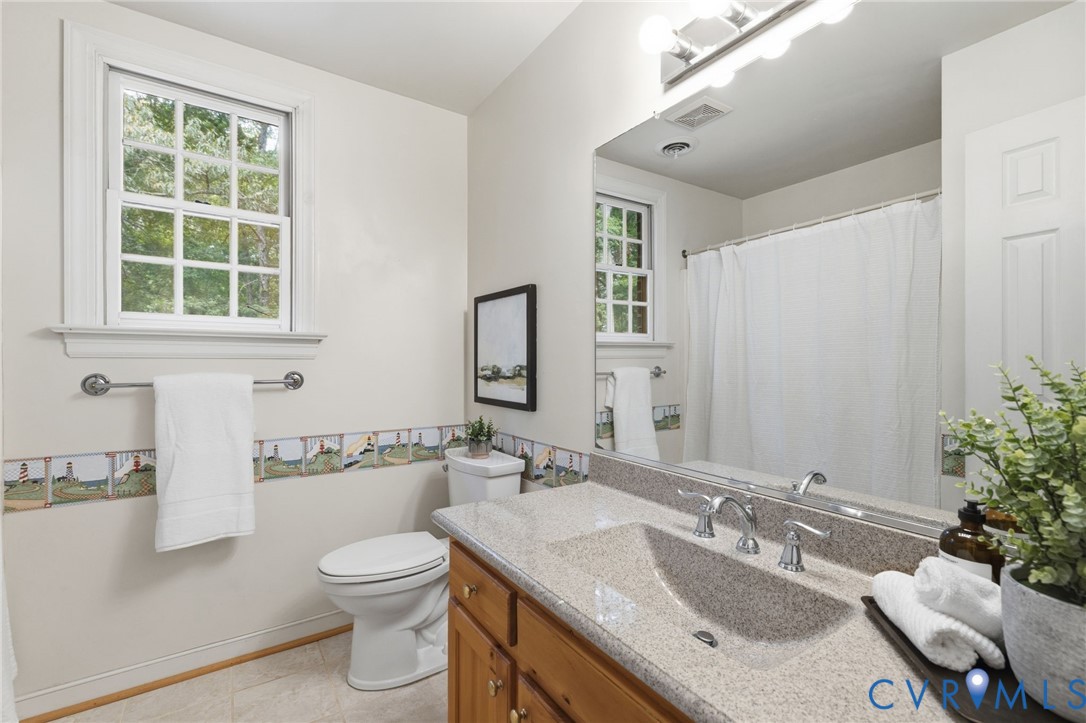 2615 Salisbury Road Midlothian, VA 23113 - Photo 23 of 36 a bathroom with a granite countertop sink mirror and a toilet