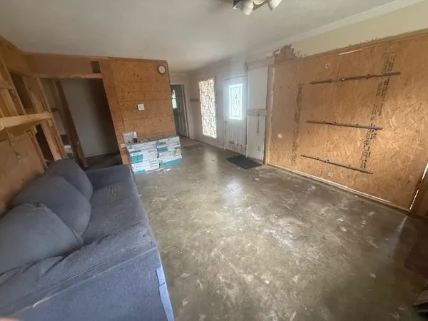 a living room with furniture and a rug