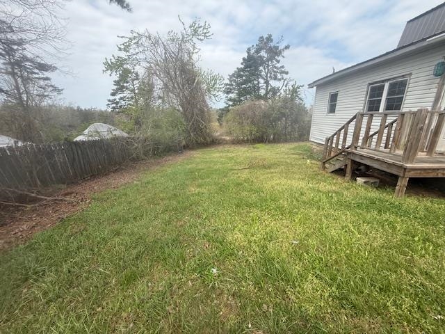 2310 Feddie Davis Road Ramer, TN 38367 - Photo 20 of 38 View of green lawn featuring a wooden deck