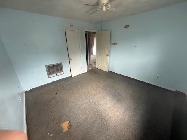 2310 Feddie Davis Road Ramer, TN 38367 - Photo 33 of 38 Unfurnished living room with carpet floors, a ceiling fan, and heating unit