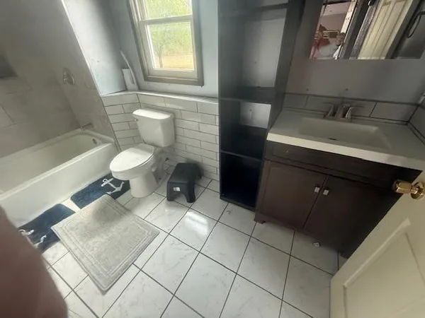 a bathroom with a sink and a toilet