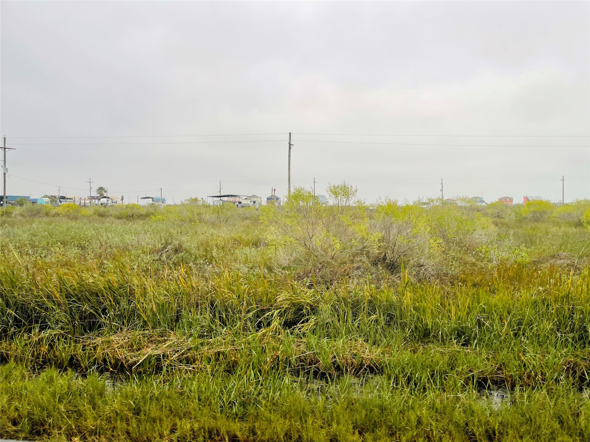 1116 Gulf Supply Road Port Bolivar, TX 77650 - Photo 3 of 9 a view of a city with lush green forest