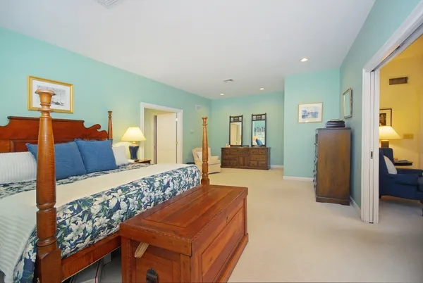 a bedroom with furniture and a dresser
