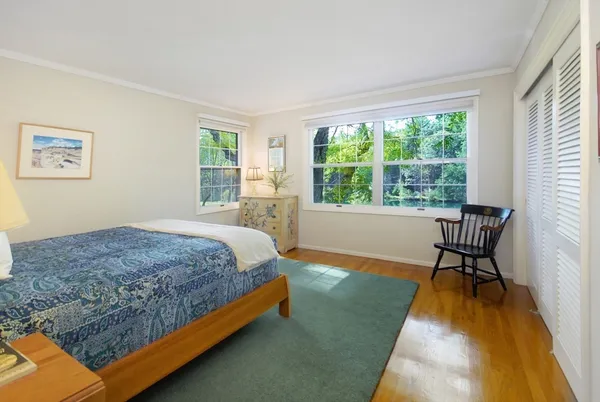 a bedroom with a bed and a table