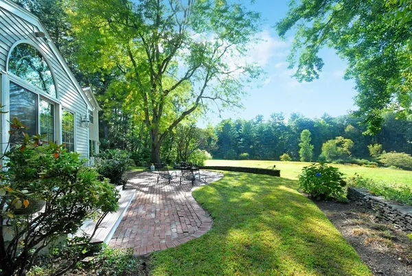 a view of a swimming pool with a patio