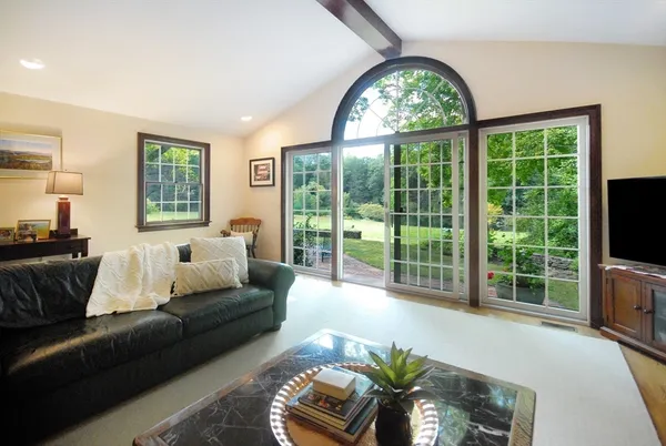 a living room with furniture and a large window