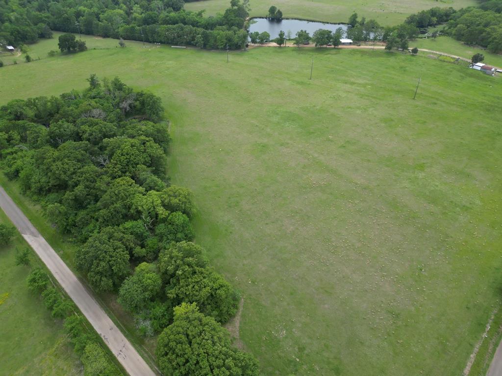 Lot 6 County Road 1560 Alba, TX 75410 - Photo 9 of 24 a view of a green yard with a swimming pool