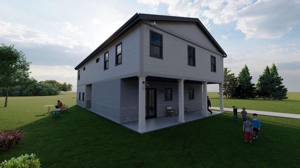 a view of an house with backyard and garden