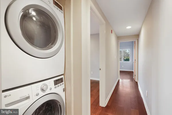 a view of a hallway with washer and dryer