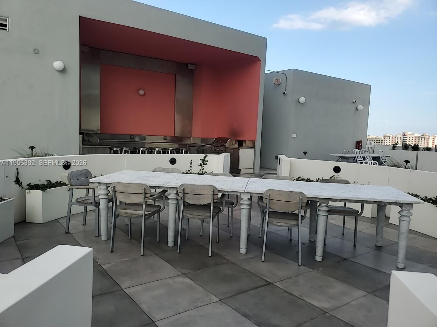 2000 Metropica Way, Unit 412 Sunrise, FL 33323 - Photo 11 of 18 a view of a dining area with furniture