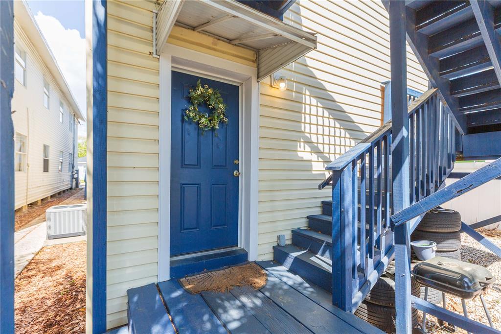 2322 West Cherry Street Tampa, FL 33607 - Photo 12 of 36 a view of front door with wooden floor and stairs