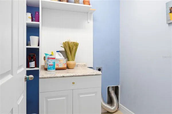 a bathroom with a sink and vanity