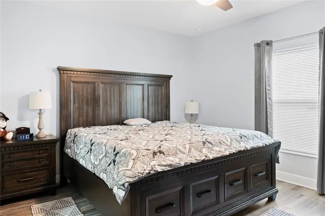 a bedroom with a bed and a dresser