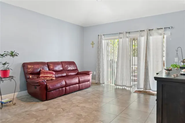 a living room with furniture and a gate