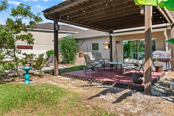 a view of a chairs and table in the patio