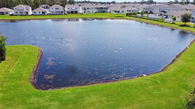 a view of a lake with a building in the background