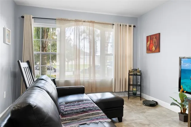 a living room with furniture and a window