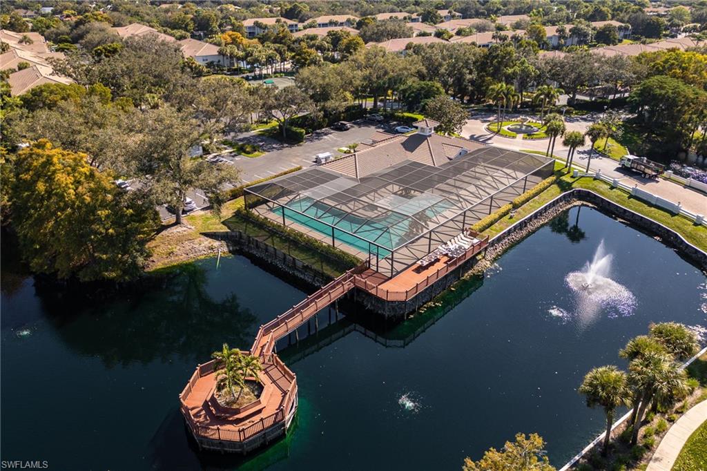 6927 Satinleaf Road North, Unit 203 Naples, FL 34109 - Photo 38 of 39 Aerial view of property and surrounding area with a large body of water