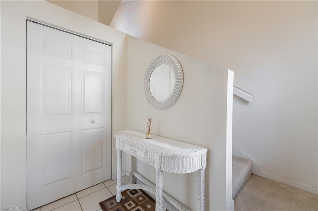 6927 Satinleaf Road North, Unit 203 Naples, FL 34109 - Photo 6 of 39 Entrance foyer featuring light tile patterned flooring