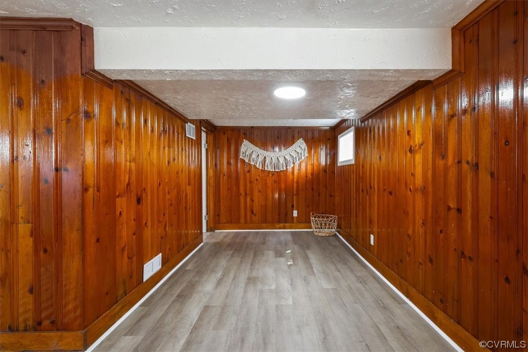 1006 Haskell Street Hopewell, VA 23860 - Photo 25 of 48 a view of an empty room with wooden floor