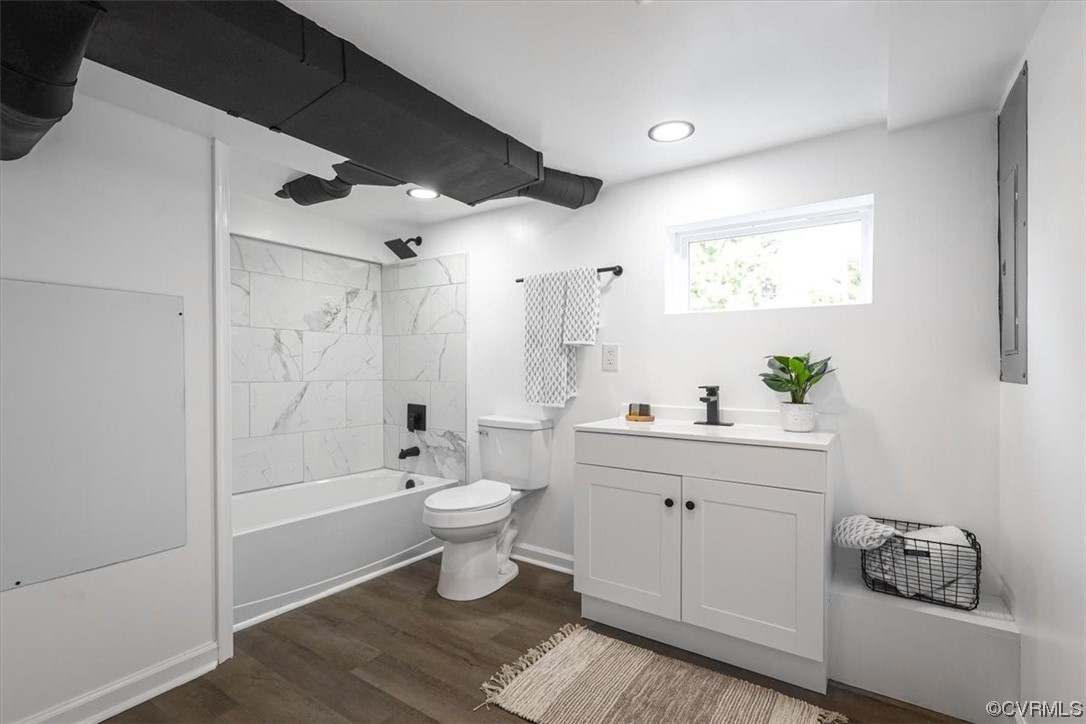 1006 Haskell Street Hopewell, VA 23860 - Photo 26 of 48 a bathroom with a granite countertop sink a toilet and shower