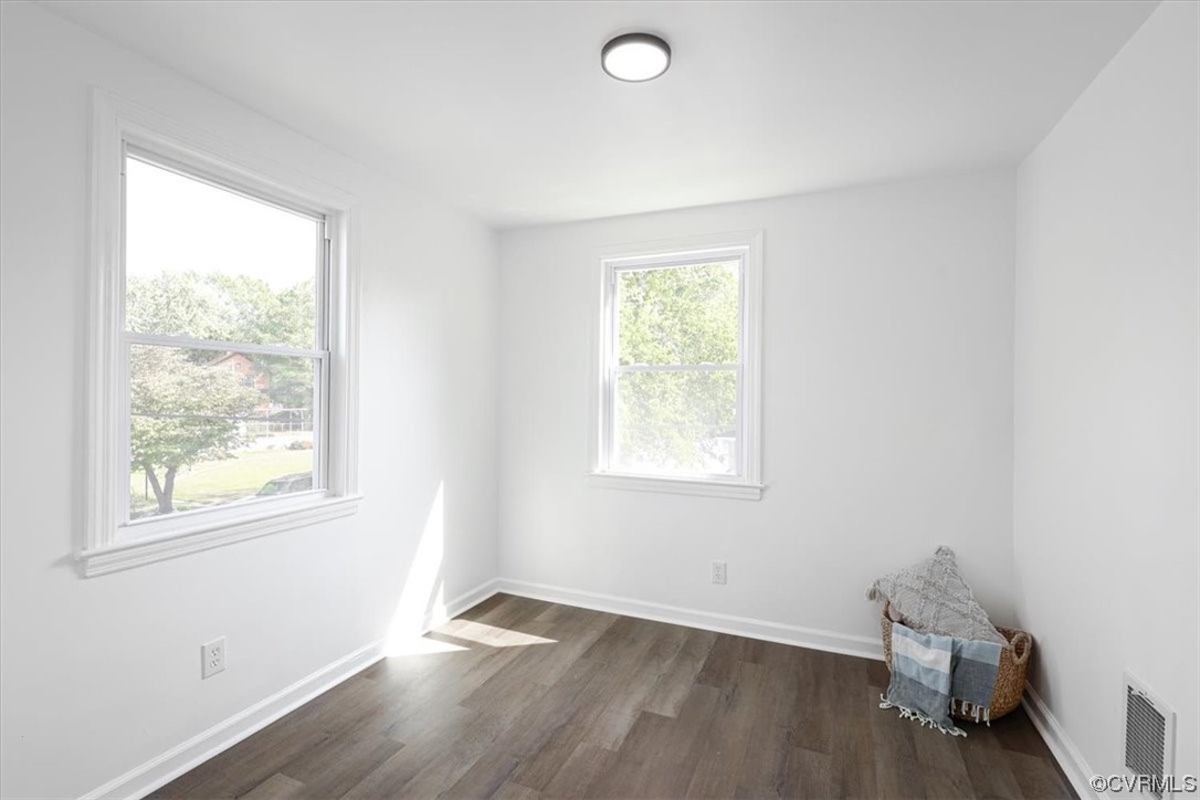 1006 Haskell Street Hopewell, VA 23860 - Photo 31 of 48 a view of an empty room with wooden floor and a window