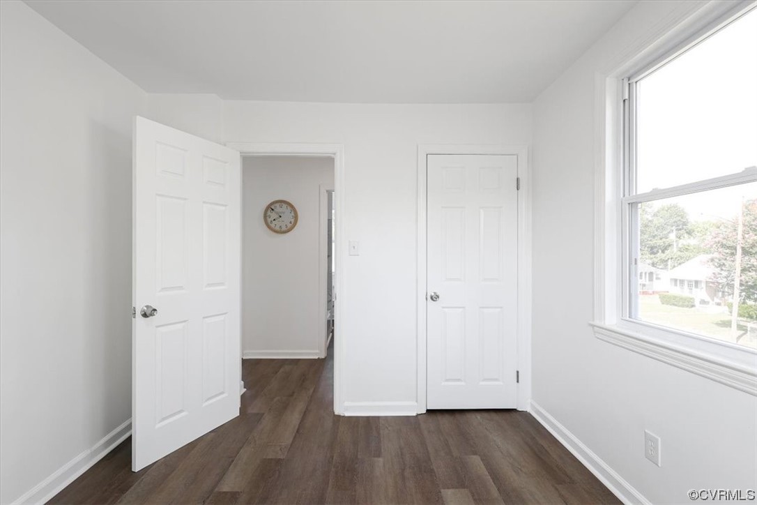 1006 Haskell Street Hopewell, VA 23860 - Photo 32 of 48 an empty room with wooden floor and a window