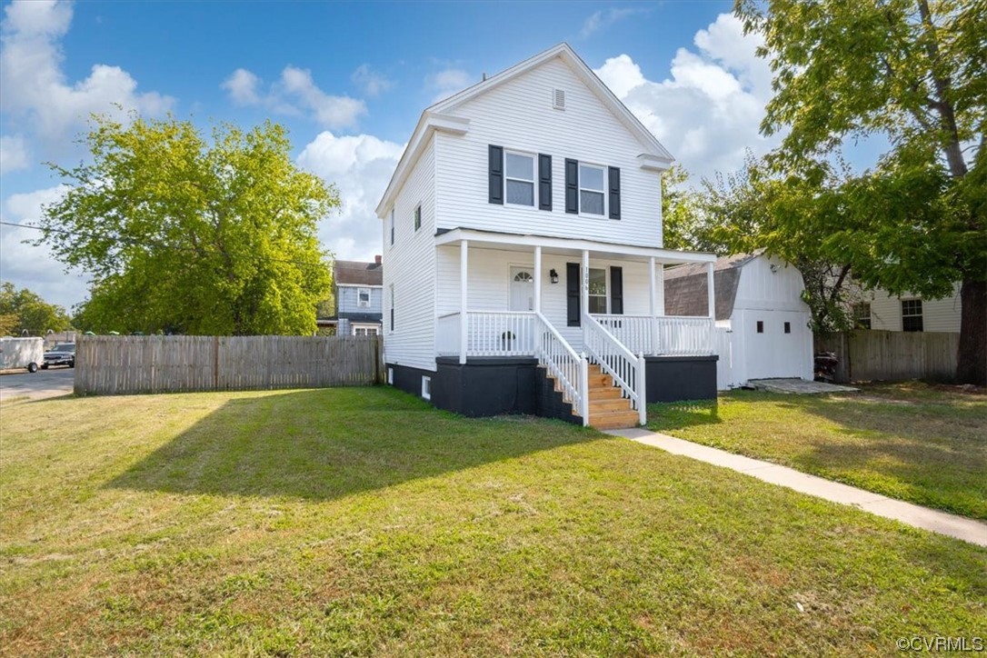 1006 Haskell Street Hopewell, VA 23860 - Photo 48 of 48 a front view of house with yard and trees in the background