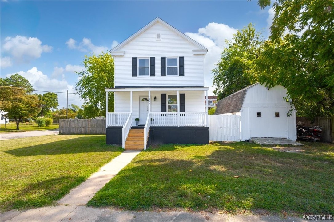 1006 Haskell Street Hopewell, VA 23860 - Photo 5 of 48 a view of a house with a yard and a large tree