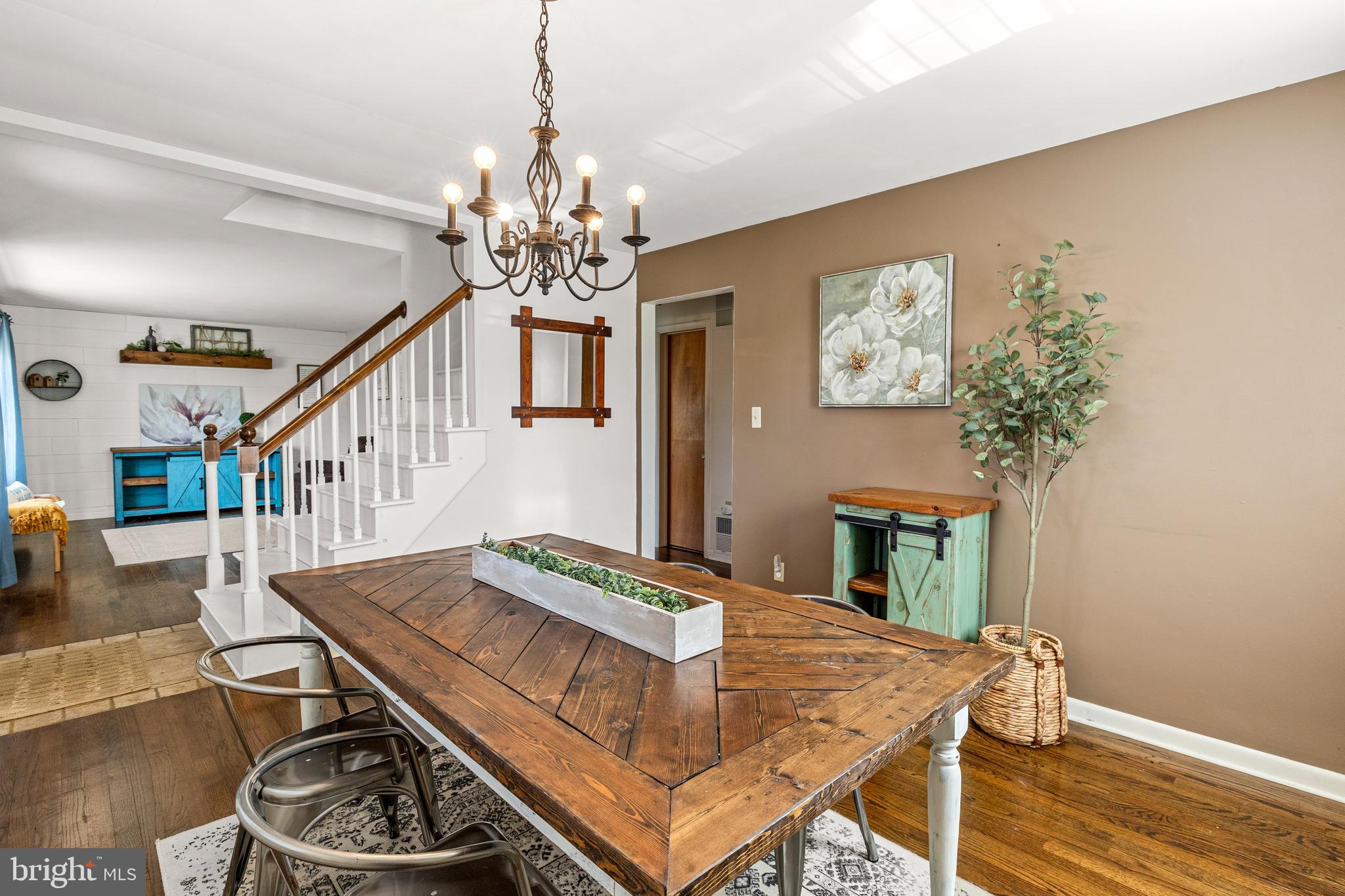 63 Quaker Hills Road Lancaster, PA 17603 - Photo 12 of 52 a living room with furniture and a chandelier