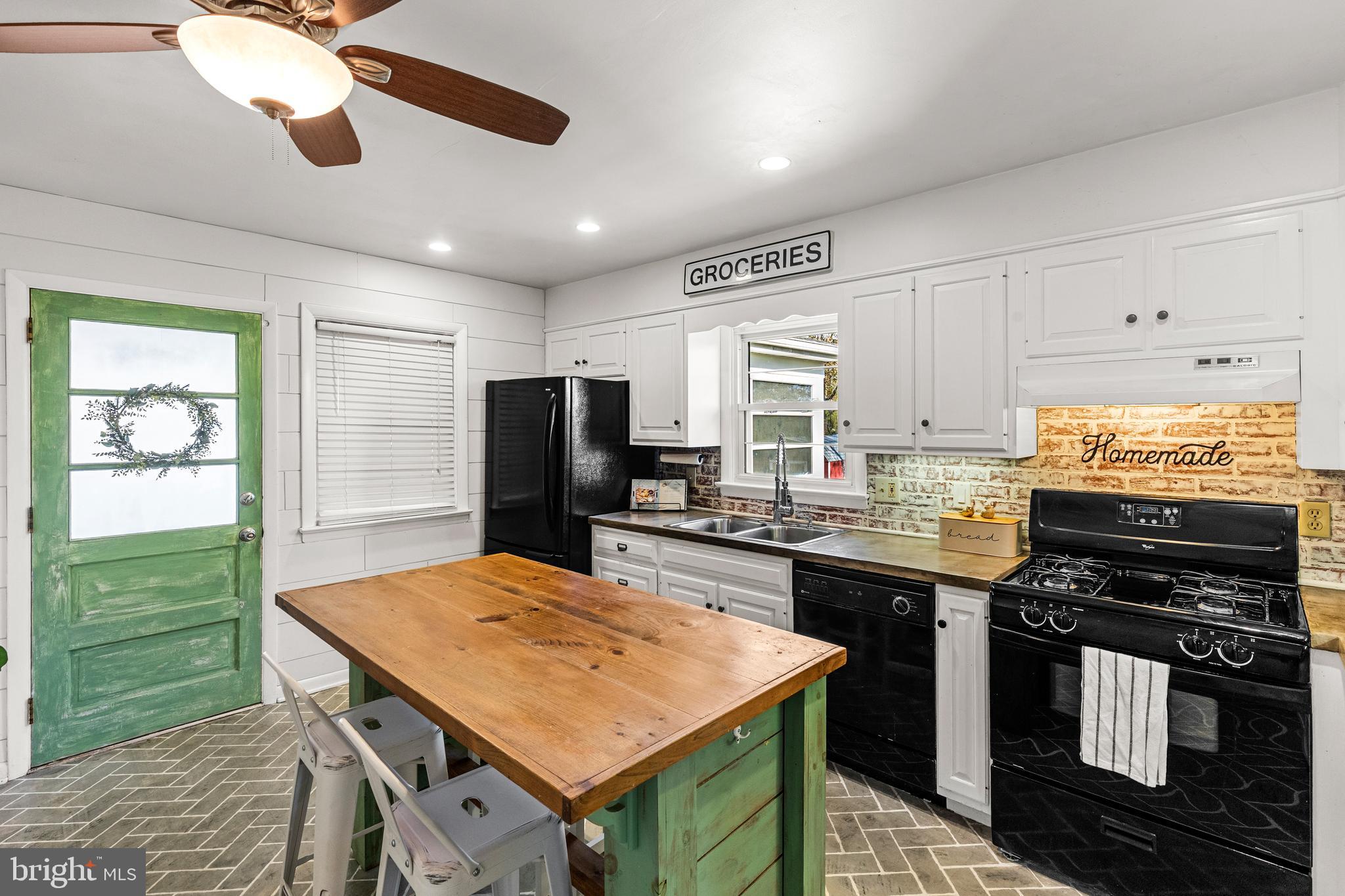 63 Quaker Hills Road Lancaster, PA 17603 - Photo 15 of 52 a kitchen with kitchen island a sink appliances and cabinets