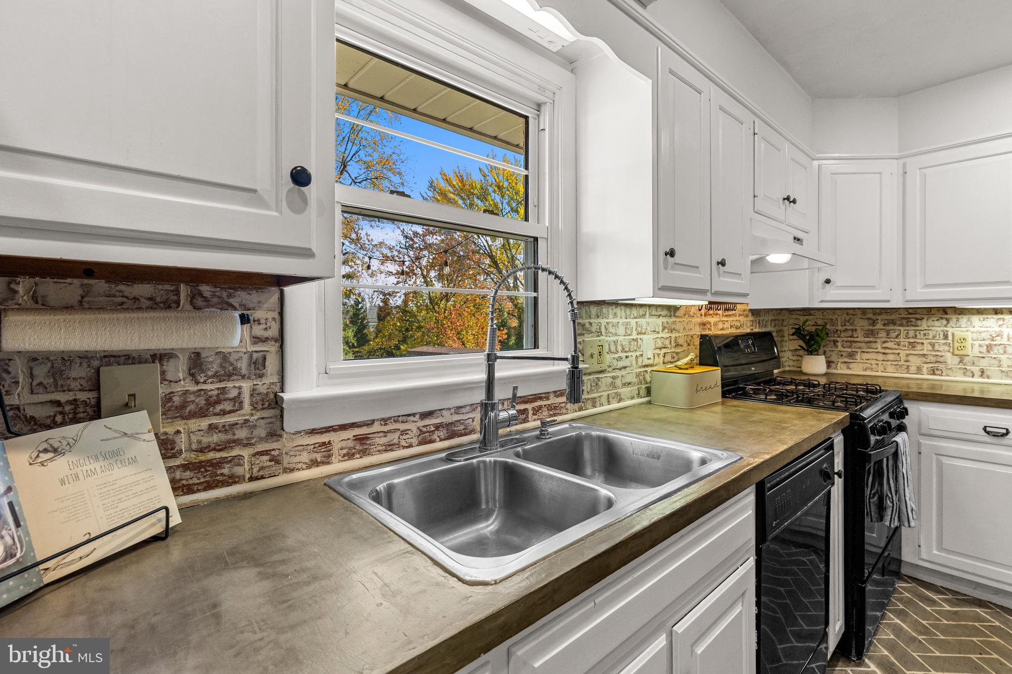 63 Quaker Hills Road Lancaster, PA 17603 - Photo 18 of 52 a kitchen that has a sink and a stove