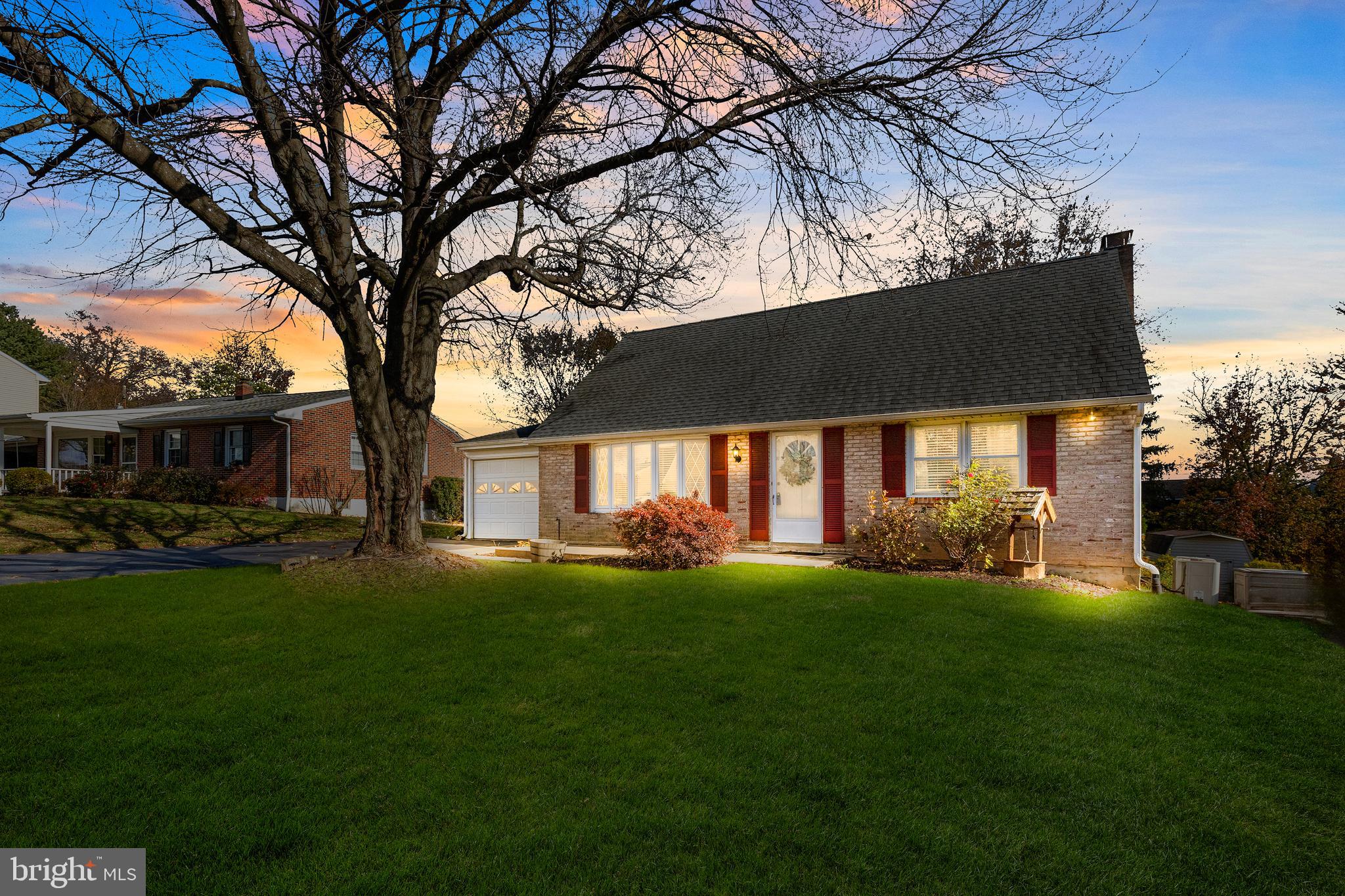 63 Quaker Hills Road Lancaster, PA 17603 - Photo 2 of 52 a front view of a house with a garden