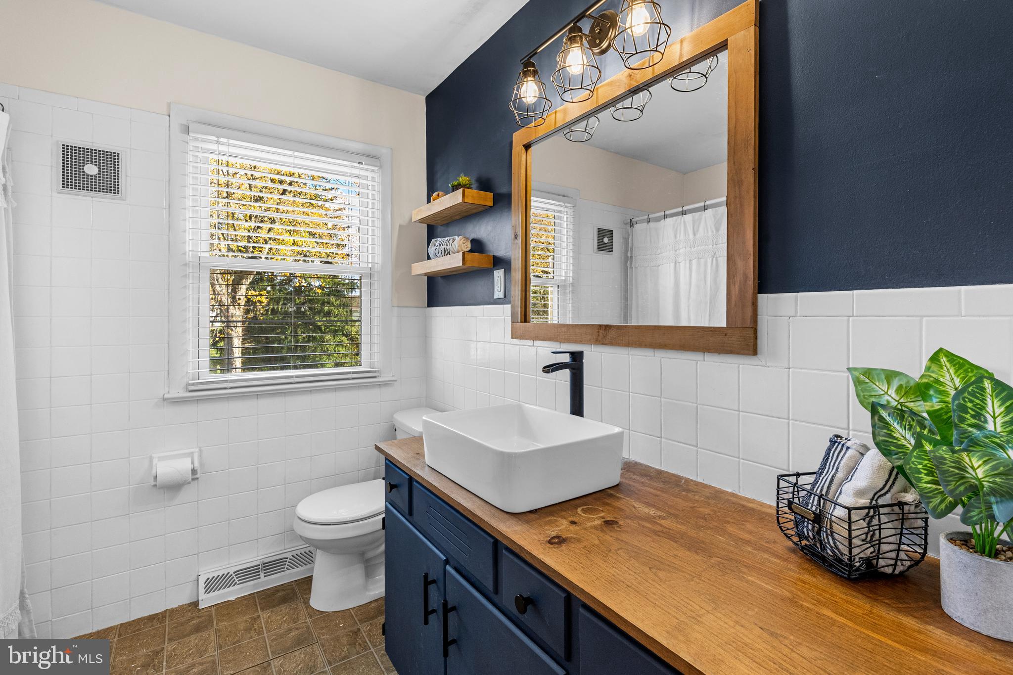 63 Quaker Hills Road Lancaster, PA 17603 - Photo 21 of 52 a bathroom with a sink toilet and mirror