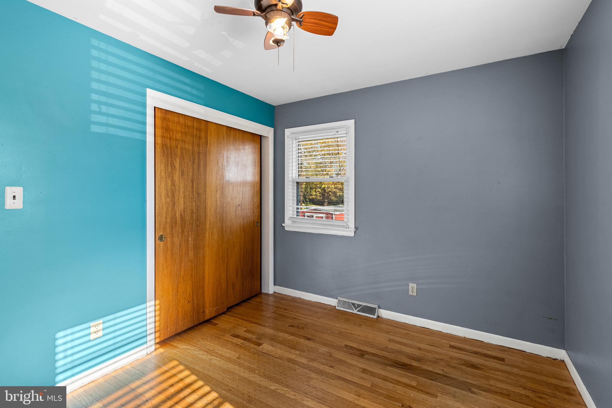 63 Quaker Hills Road Lancaster, PA 17603 - Photo 25 of 52 an empty room with wooden floor fan and windows