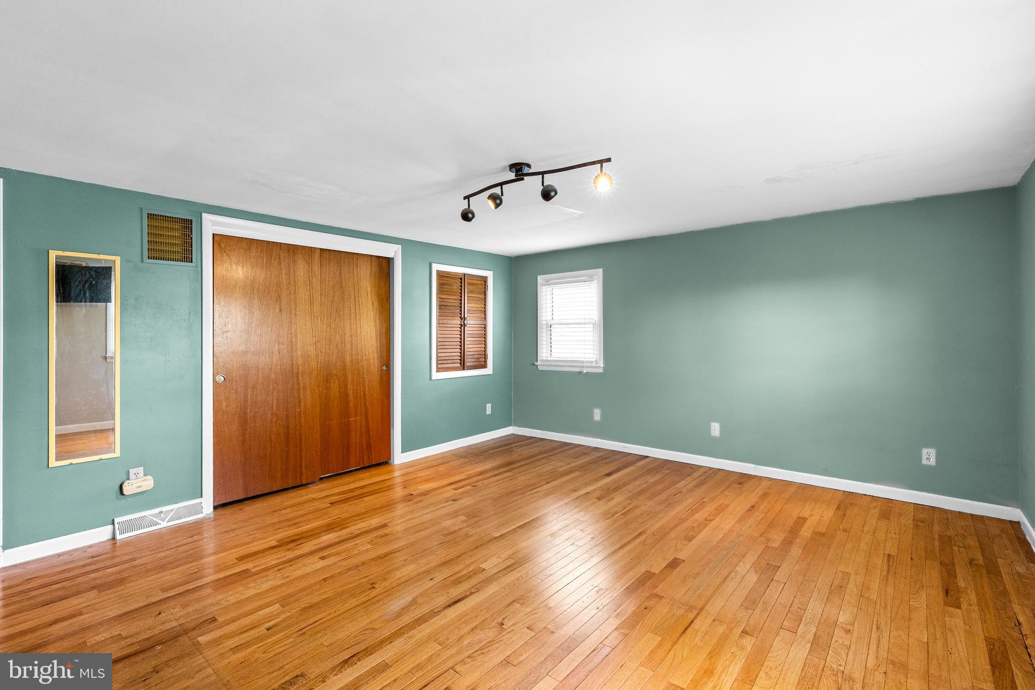 63 Quaker Hills Road Lancaster, PA 17603 - Photo 26 of 52 a view of an empty room with window and wooden floor