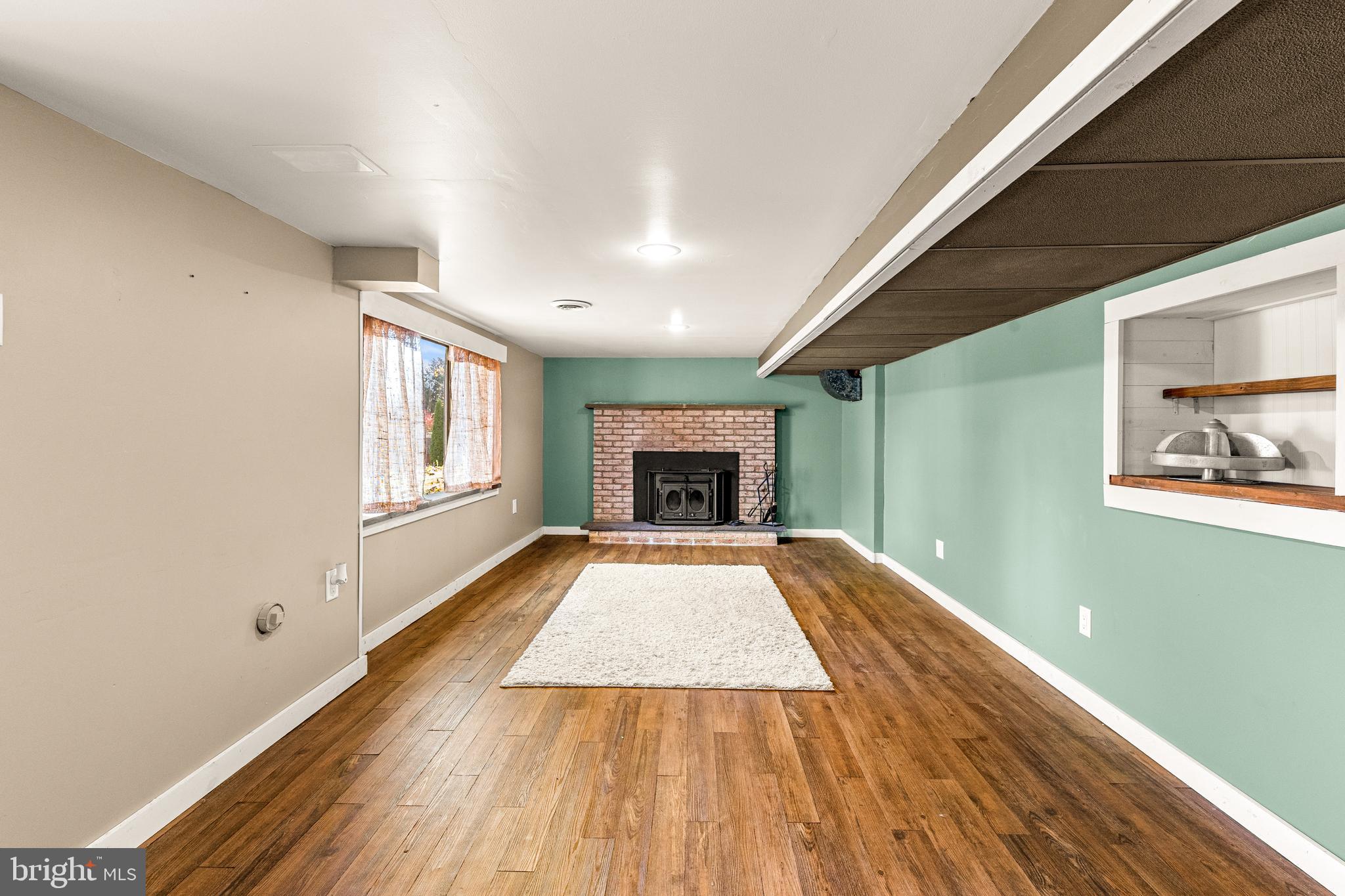 63 Quaker Hills Road Lancaster, PA 17603 - Photo 40 of 52 a view of an empty room with wooden floor and a window