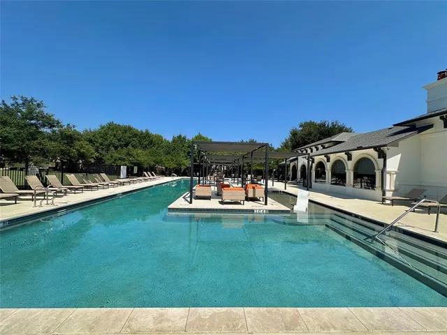 a view of a swimming pool with a patio