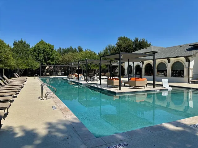 a view of swimming pool with chairs