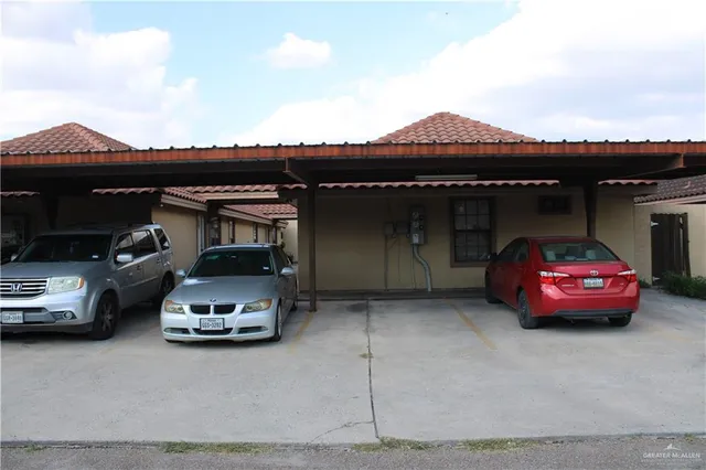 a view of a brick house with a large windows