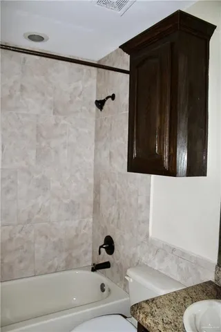 a bathroom with a bathtub and shower