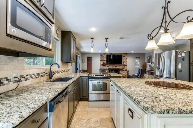 a kitchen with a stove and a sink
