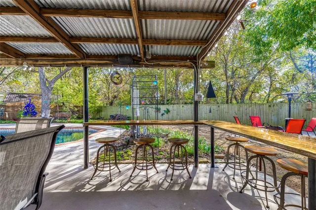 a view of a patio with a table chairs and a patio